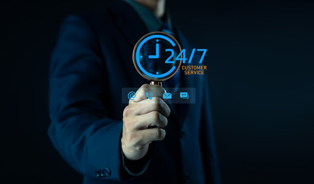business professional typing on a laptop with a 24 service icon overlay, symbolizing continuous support, online availability, customer service accessibility, and nonstop digital operation in a modern.