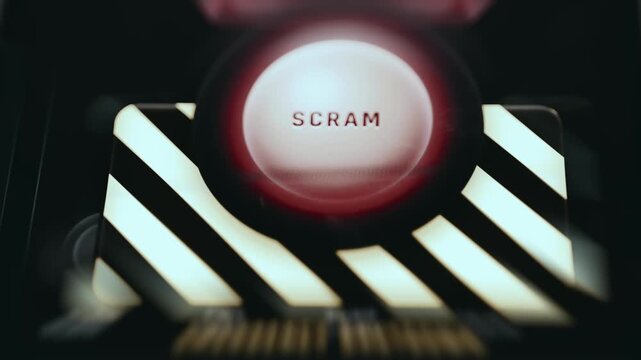 Red glowing SCRAM button being activated
