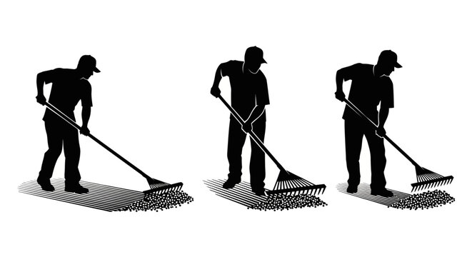 Worker sweeping floor with push broom in action.