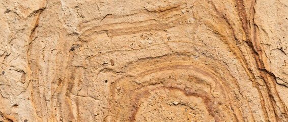 Sandstone striking natural layered stone texture with flowing sediment patterns and earthy mineral formations for premium design backgrounds © UmmeFarhatunnesa