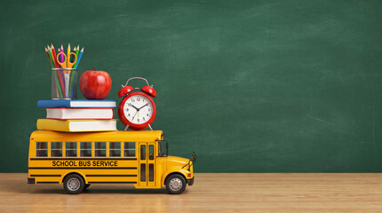 Obraz premium School back to school bus toy yellow pencil stack book apple alarm clock education concept over wood. public school bus vehicle. elementary children student education, car transportation travel