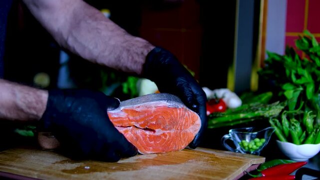 Step by step pan fried salmon steak recipe with fresh trout fillet seasoning oil and golden crust cooking process in black frying pan for homemade seafood meal