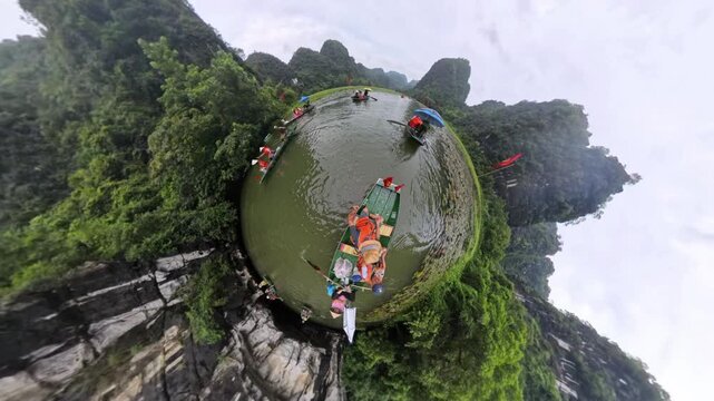  Asia, Ninh B&igrave;nh and Tam Coc 03,20,2026 Trang An in the Red River Delta region of Vietnam , Vietnamese boats transport tourists in limestone karst formations.  Unesco Heritage world  Halong Bay on Ear