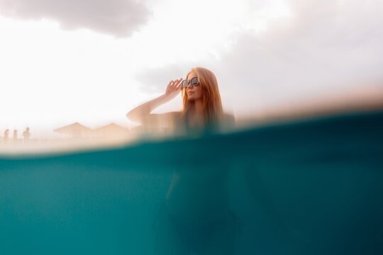 Young woman enjoying summer vacation in water