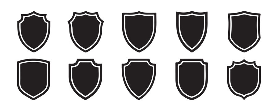 Black silhouette shield icons for military protection and security services logo design collection.