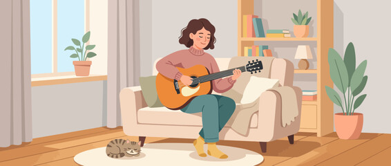 Fototapeta premium Woman playing guitar on sofa with cat