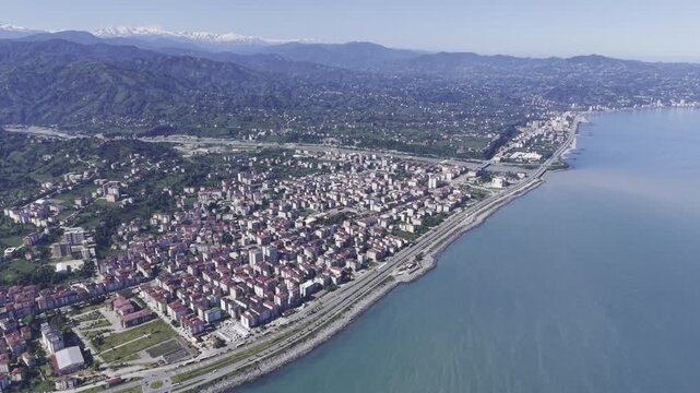 Aerial Drone Footage of Ardesen Town Center in Rize Turkey Featuring Black Sea Urban Landscape, Green Hills and Mountain Scenery
