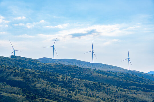 Wind turbines on mountain ridges near Charvak. Concept: Renewable green energy and sustainability