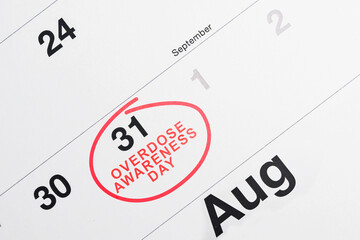 Obraz premium A close-up shot of a calendar page with August 31 circled in red ink and the text Overdose Awareness Day written inside, highlighting the international awareness day