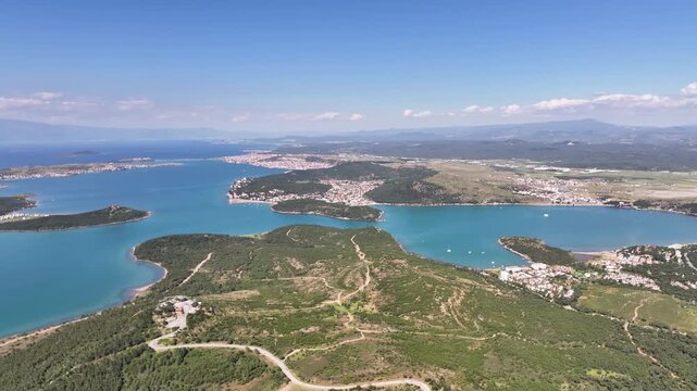 Stunning aerial footage of the beautiful coastline, islands, and turquoise sea in Ayvalik, Turkey, oe01