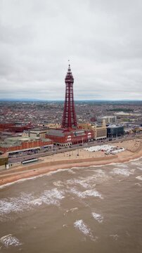 Aerial landscape view of Blackpool and Golden Mile Promenade in the holiday destination town in the Lancashire seaside resort of Blackpool, UK