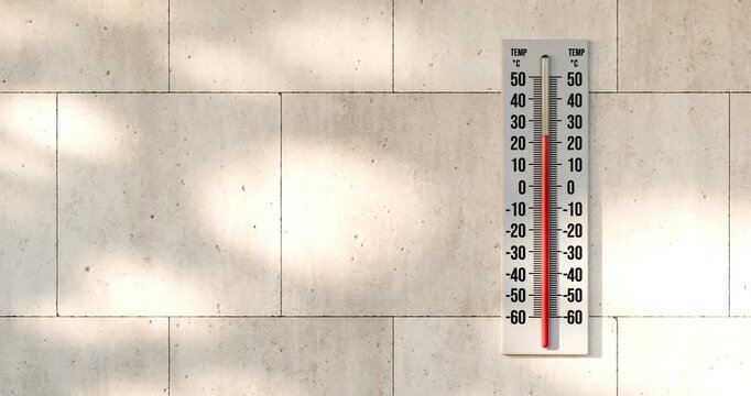 3D animation of celsius thermometer on modern stone wall with rising temperature and intense sunlight glare