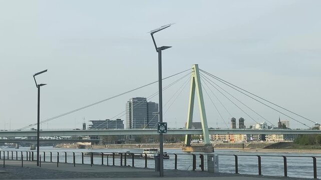 View of Grosser Bridge from the embankment in Cologne along the river