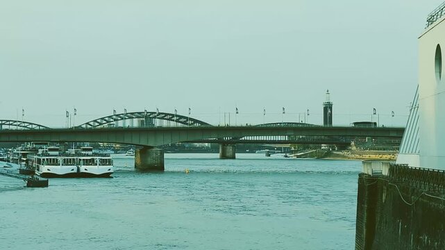 Cologne embankment and bridge view during a calm day along the river