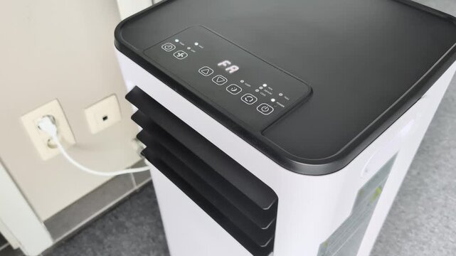 Adjusting fan speed and air direction on a room air conditioner for better cooling