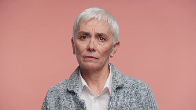 Mature Woman Speaking First Person View on Pink Background