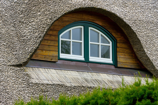 Traditional Thatched Roof House with Moss Covered Reed Roof