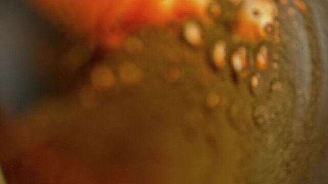 Super Slow Motion Shot of Rippling Fresh Beer With Bubbles at 1000fps.