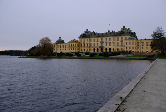Stockholm, Sweden-Nov.27th 2025: Wide angle view of Drottningholm Palace in Sweden on an overcast day, historic building by the water.