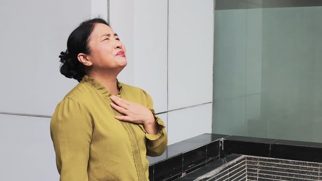 allergic senior woman having sore throat with cold, flu or virus infection