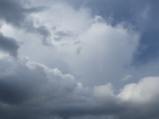Obraz premium Dramatic Sun Rays Breaking Through Dark Storm Clouds