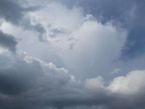 Dramatic Sun Rays Breaking Through Dark Storm Clouds