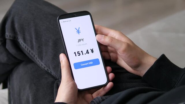Mobile currency converter showing the live JPY to USD exchange rate. User views the 151.4 conversion value for the Japanese Yen. Perfect for Asian market trading, foreign exchange apps