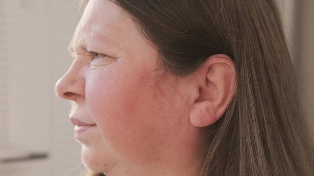 mature woman experiencing agony earache pain, touching ear, ringing and auditory hallucinations, hearing perception, mental health, unusual sounds, sensitivity Tinnitus symptom, sound perception