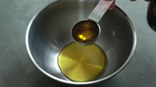 Mixing Fresh Herbs and Parmesan Cheese into Paste in a Bowl Close Up