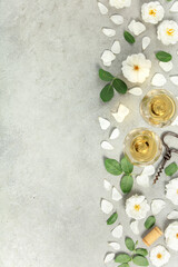 Obraz premium Wine Tasting Flat Lay with Roses, Petals, and Corkscrew