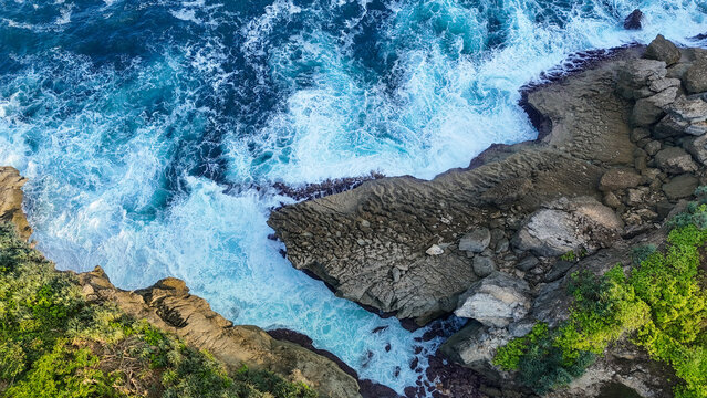 Aerial View of a Dramatic Rocky Coastline and Crashing Ocean Waves at Hidden Gems Beach, Tulungagung Regency-East Java
