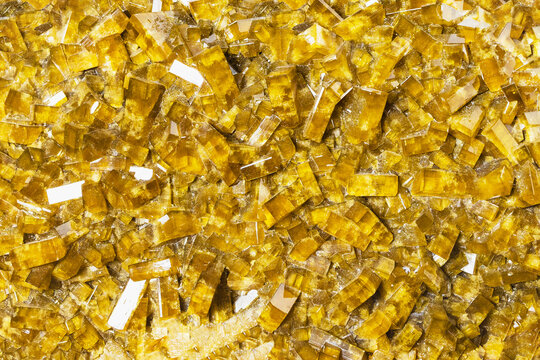 surface of yellow baryte crystalline rock close-up