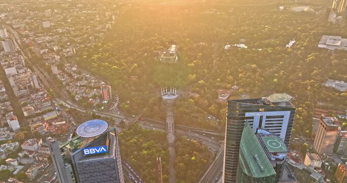 Mexico City Aerial v28 high angle birds eye view reverse flyover paseo de la reforma away from bosque de chapultepec capturing downtown cityscape at sunset - Shot with Mavic 3 Cine - December 2021