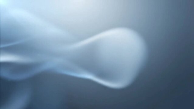 Close-up of abstract white smoke swirling gracefully against a soft blue and grey gradient background, creating a serene and ethereal atmosphere.