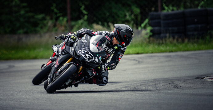 Regular training in Riga, Latvia, Bikernieki on 12-05-2026  Motorcyclist leaning into curve on paved road