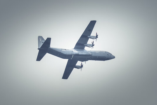 Regular training in Riga, Latvia, Bikernieki on 12-05-2026  Turboprop Aircraft in Flight Against Cloudy Sky