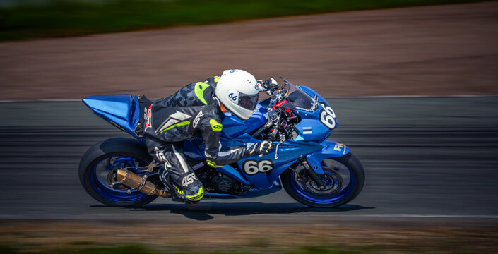Regular training in Riga, Latvia, Bikernieki on 12-05-2026  Racer on blue sport motorcycle racing on track