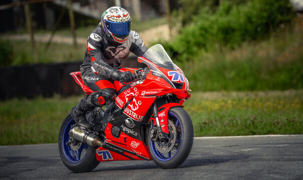 Regular training in Riga, Latvia, Bikernieki on 12-05-2026  Motocross Rider on a Red Race Bike
