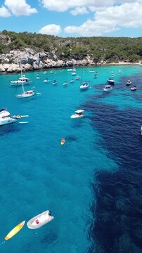 Aerial Drone View of Cala Macarella Beach With Boats Turquoise Water and Mediterranean Cove in Menorca Spain