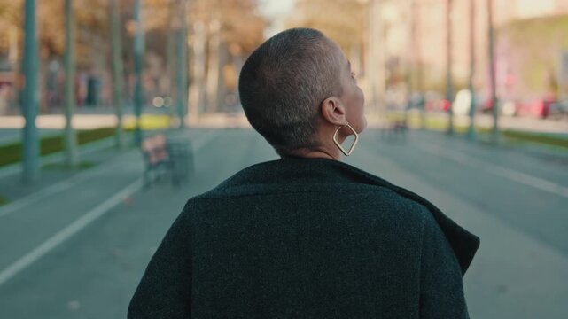 Confident Woman Walking on a City Street