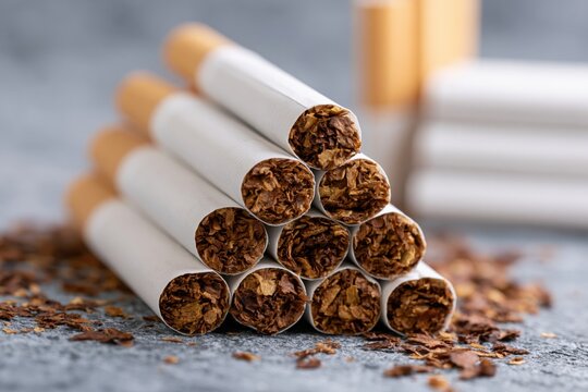 The Cigarettes Pyramid Closeup of Cigarettes and Loose Tobacco Spills