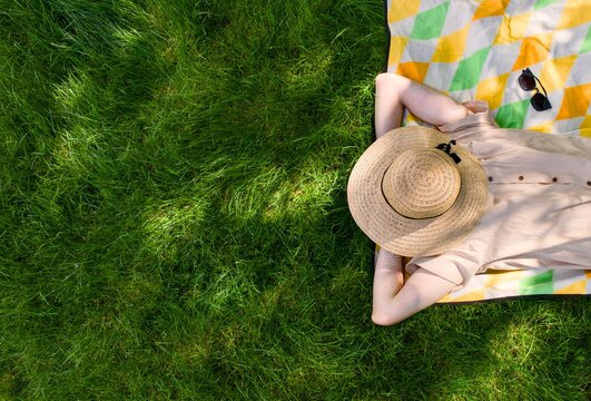 Sunbathing on Grass with Hat