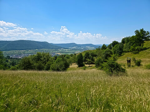 germany, spectacular valley landscape overlooking dettingen an der erms surrounded by vibrant green scenery from the summit of jusenberg