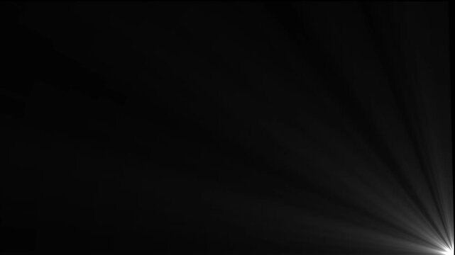 Bright white light flare emanating from the bottom right corner against a solid black background creating a soft glowing ray effect for overlays