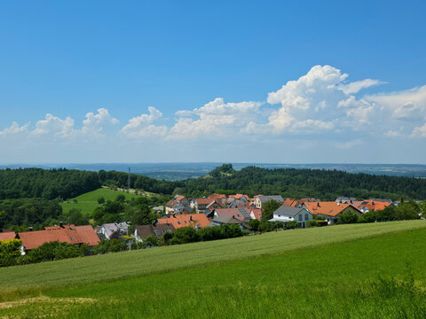 germany, panoramic view across kappishaeusern village rooftops framed by vibrant green fields and peaceful swabian alb countryside landscapes
