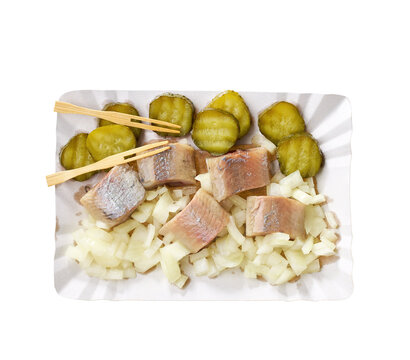dutch snack with herring, pickles and onion in paper tray isolated on white background, top view.