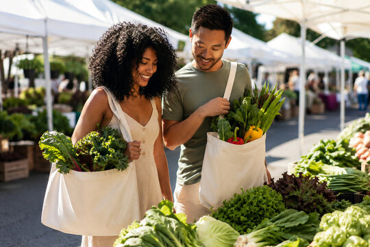 Couple shopping fresh vegetables at farmers market