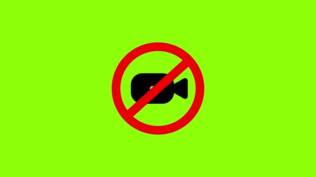 No recording sign with a black camera inside a red forbidden circle isolated on a bright green background for chroma key compositing