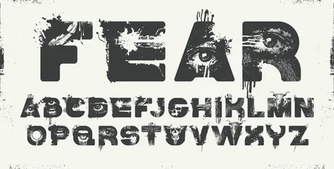 A vector art font for word-images FEAR with bull and human scull, streaks, and scratches. Capital Letters. The theme is horror, grunge, and urban. Madness, post-apocalypse, and underground. Punk poste © paseven