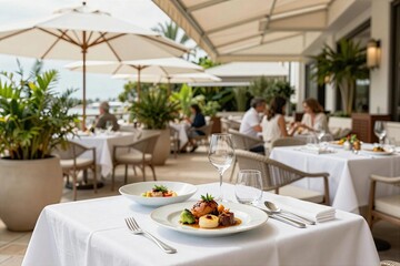 Fototapeta premium Enjoying lunch on a sunny day at an outdoor restaurant with friends and family